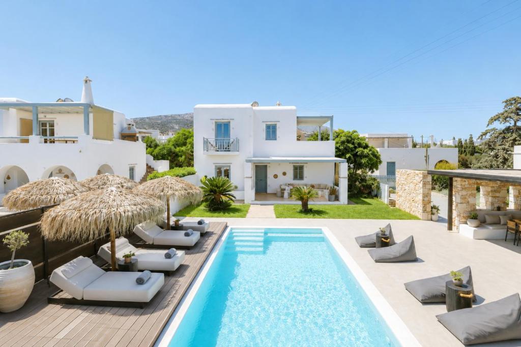 a villa with a swimming pool and a house at Villa Vanta in Drios