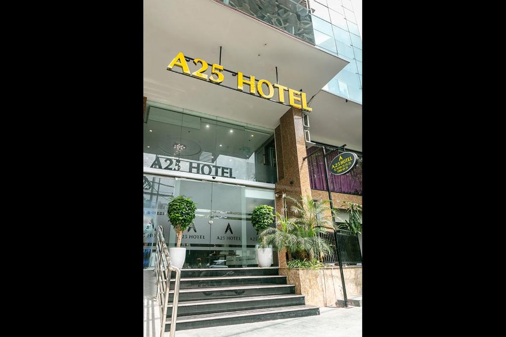 hotel with stairs in front of a building at A25 Hotel - 21 Le Duc Tho in Hanoi