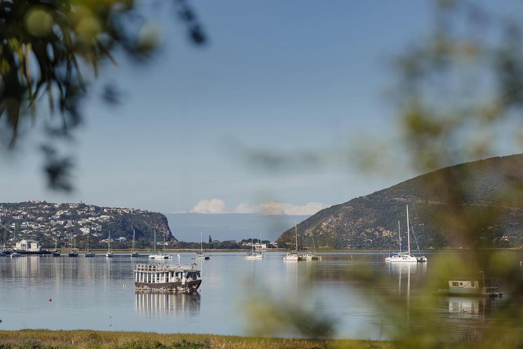 a view of a lake with boats in the water at Lagoon Views in Knysna