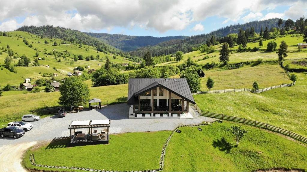 an aerial view of a house in a green field at Sadova Loft View in Sadova