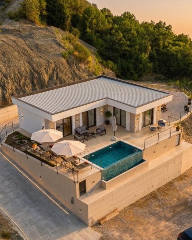 an aerial view of a house with a swimming pool at Alta Vista House in Bar