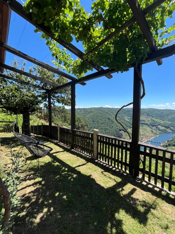 a view from the porch of a house with a bench at Mirar&Soñar in Chantada