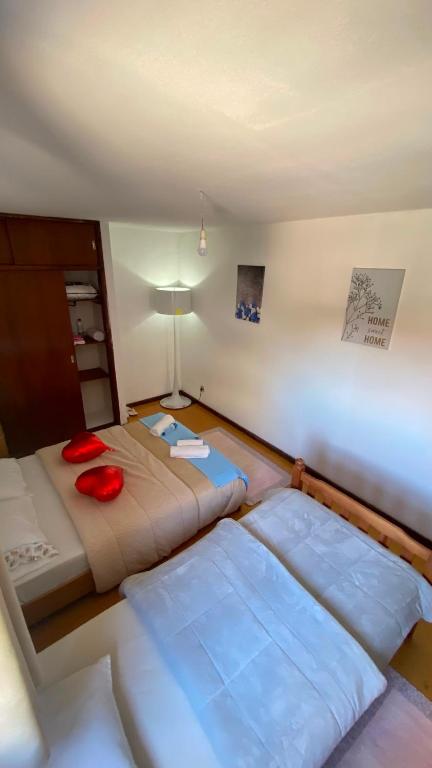 a room with two beds in a room at Daboussi Home in Apúlia