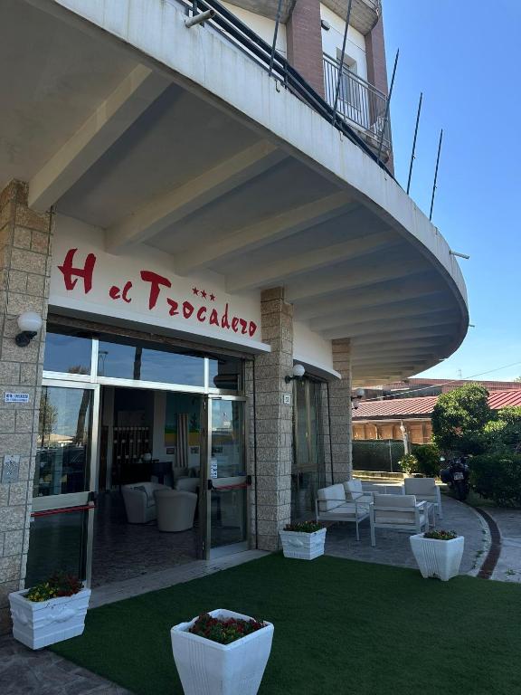 a building with a sign that reads h retrieval at Hotel Trocadero - Koolibry Hotels in Cervia