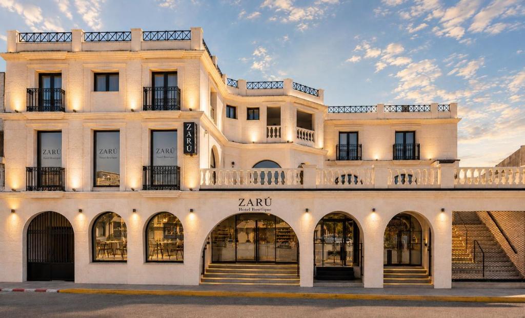 a large white building with a lot of windows at Zarú Hotel Boutique in Mocejón