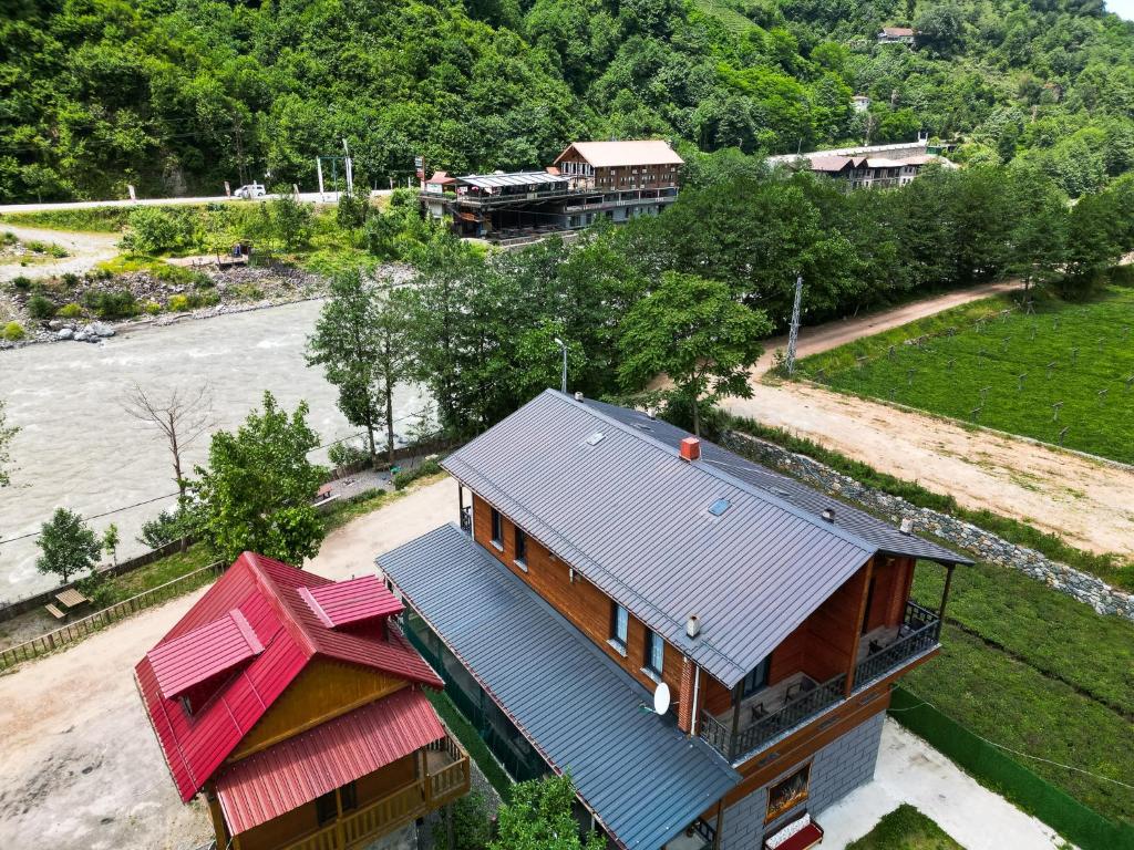 an aerial view of a house next to a river at Pallas Suit in Ardeşen