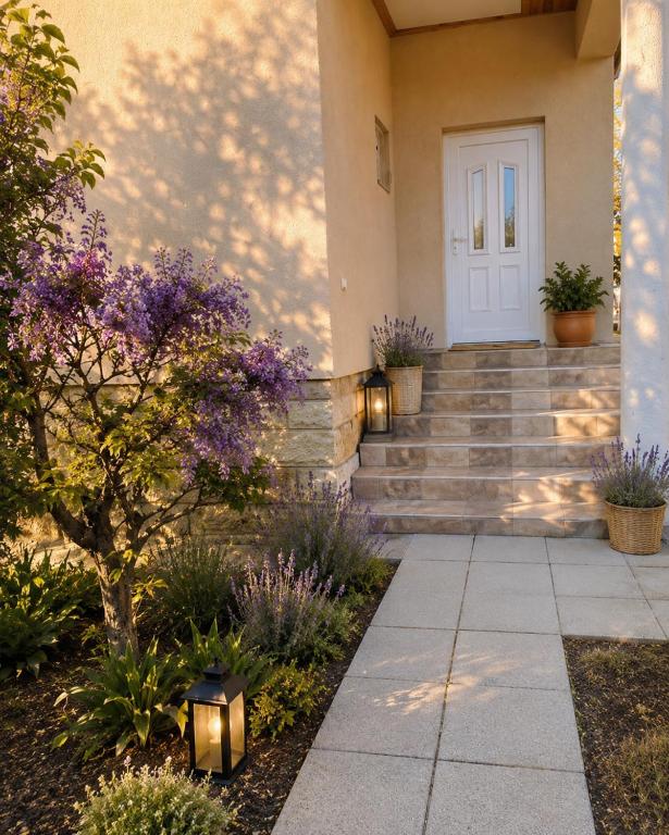 a front door of a house with purple flowers at Levendula Vendégház in Verpelét