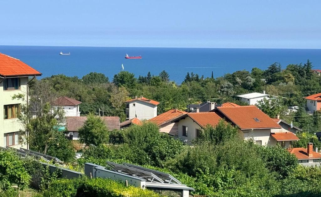 a city with houses and the ocean in the background at Balchik Sea View Studio in Balchik
