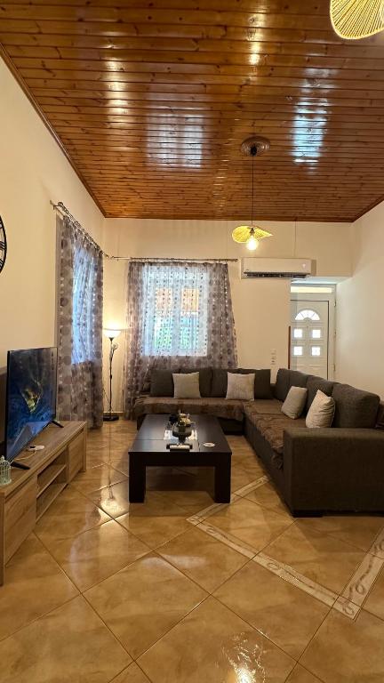 a living room with a couch and a coffee table at Todos home in Amalias