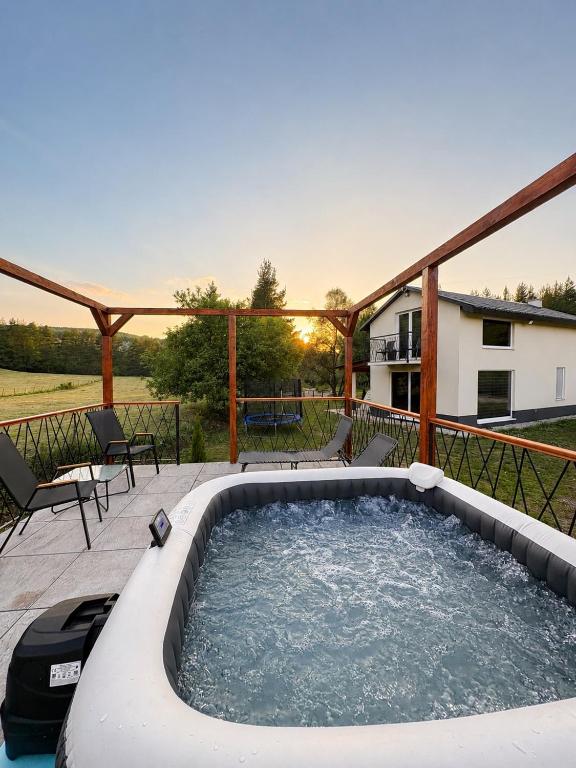 a hot tub on the deck of a house at Villa Marija in Livno