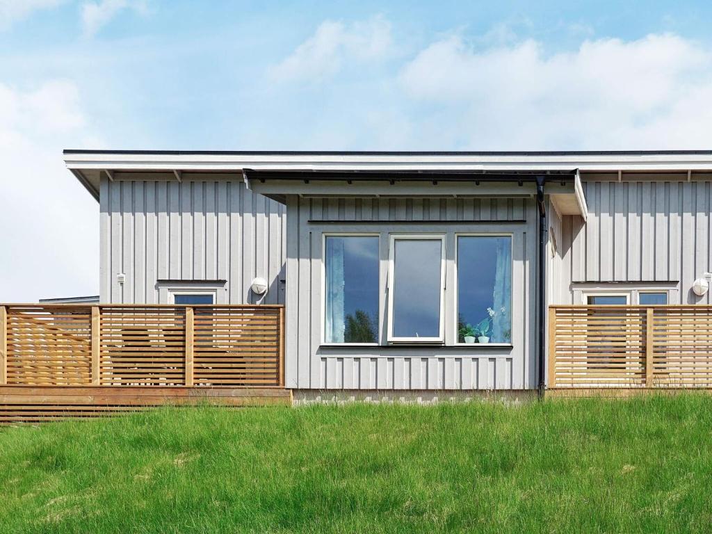 a house with a large window on the side of it at 5 person holiday home in STRÖMSTAD in Strömstad