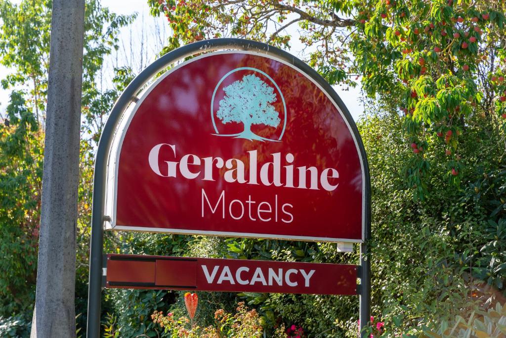 a sign for a gardenine motel with a red sign at Geraldine Motels in Geraldine