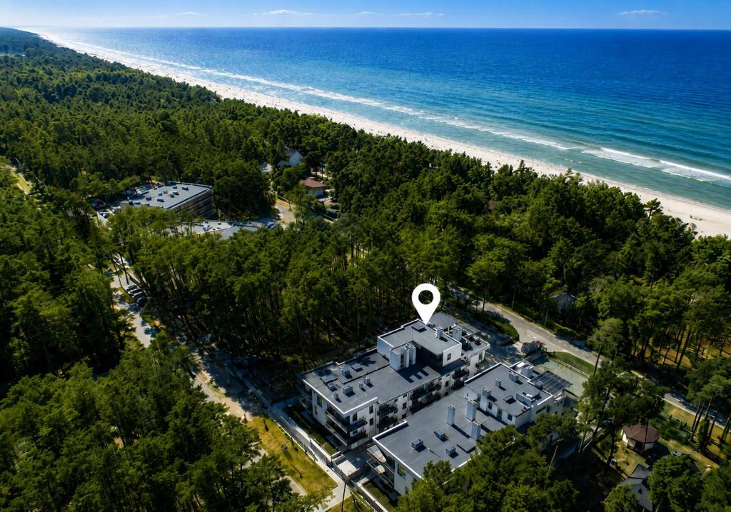 an aerial view of a house next to a beach at Baltic 4YOU in Pobierowo