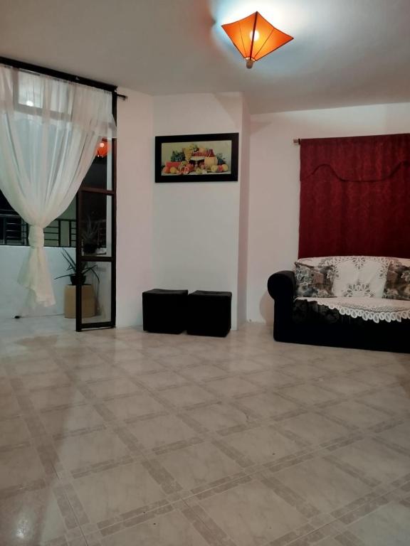 a living room with a couch and a window at DESTINY Apto Parque in San Rafael