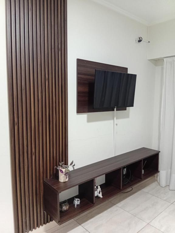 a living room with a television on a wall at Ayres Apart in Chivilcoy