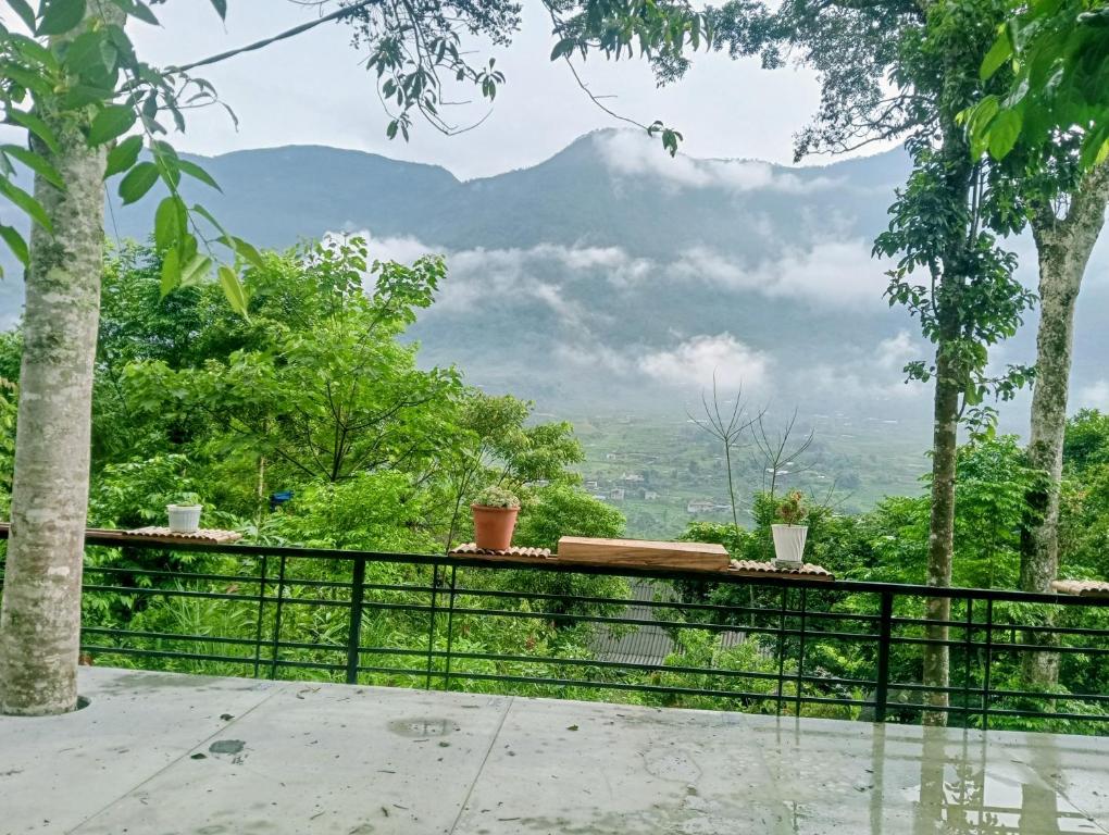 a balcony with a view of a mountain at May Lai Homestay in Tả Van