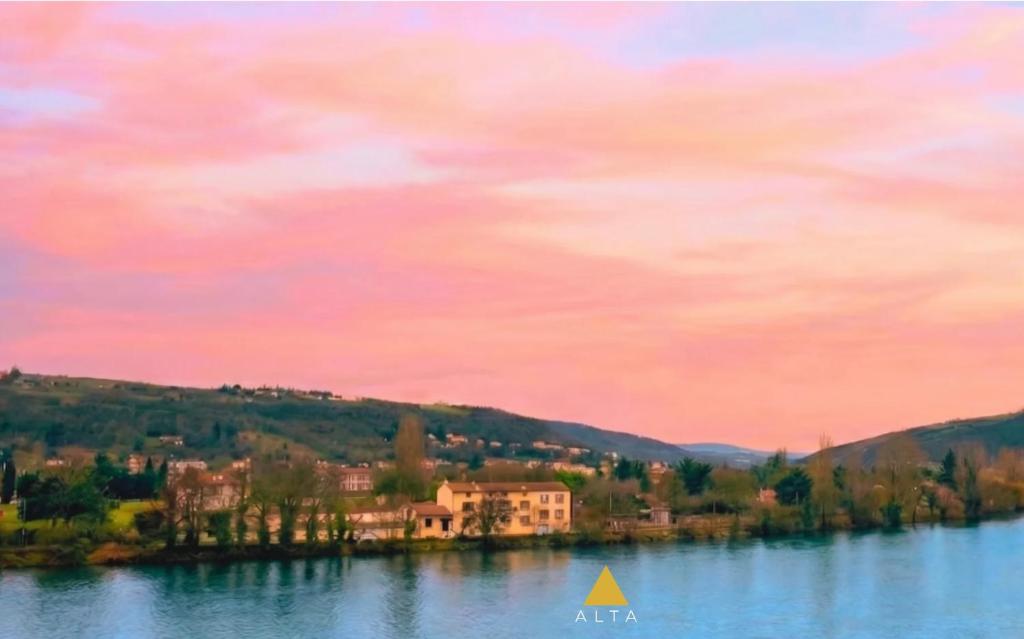 a painting of a house on a island in a lake at LE 21 - Suite SPA Premium - Jacuzzi Privatif & Vue Rhône in Vienne