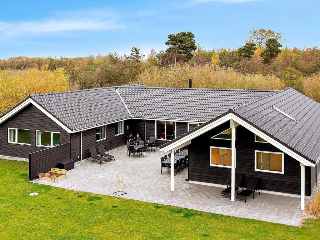 an overhead view of a house with a patio at 5 star holiday home in Idestrup in Bøtø By