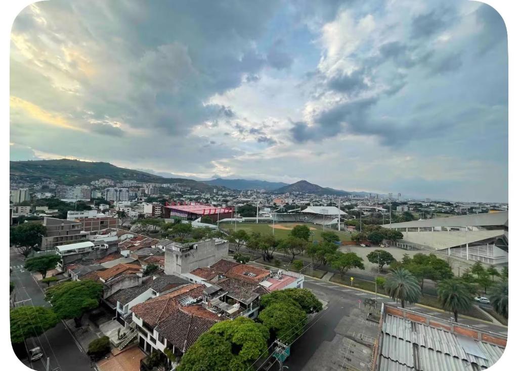an aerial view of a city with buildings and trees at Apto cerca zona deportiva Vista Panorámica LEPARC in Cali