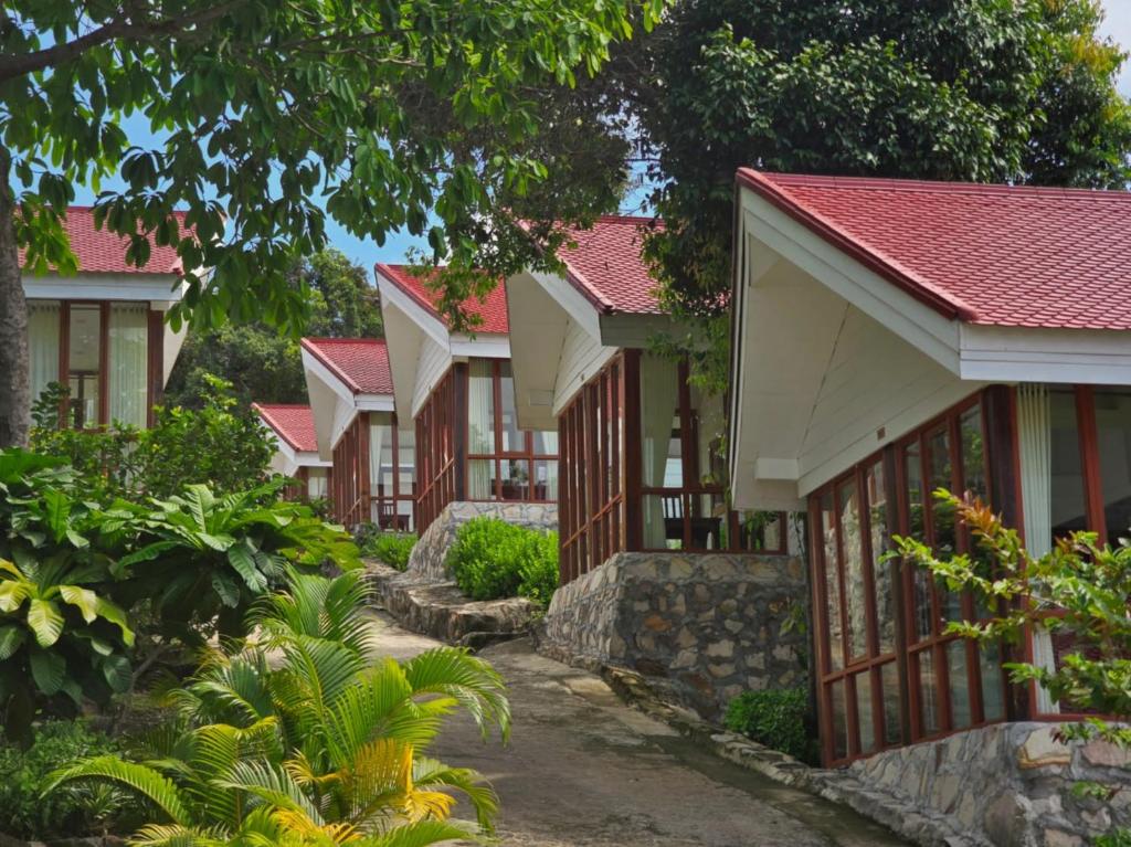 a row of houses with red roofs at Alicia Resort in Koh Rong Island