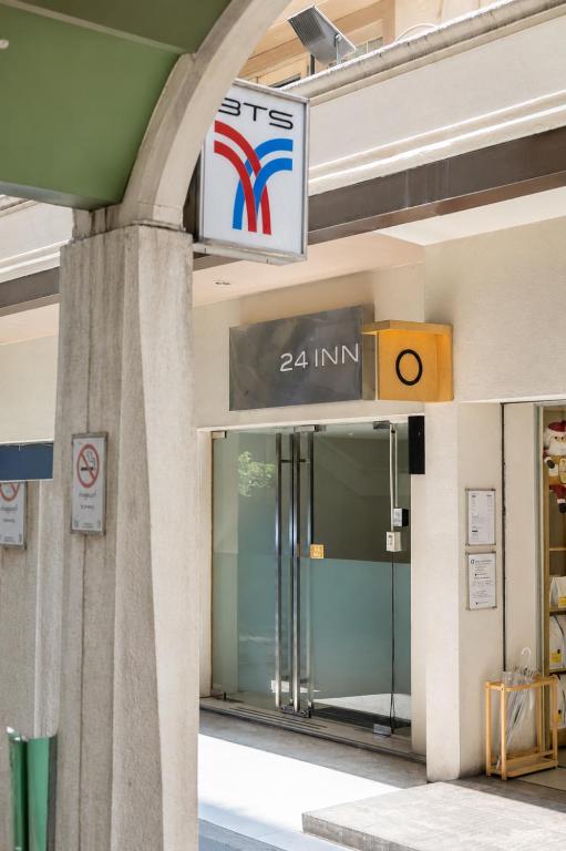 a sign for the entrance to a building at 24 Inn at BTS Phrom Phong in Bangkok