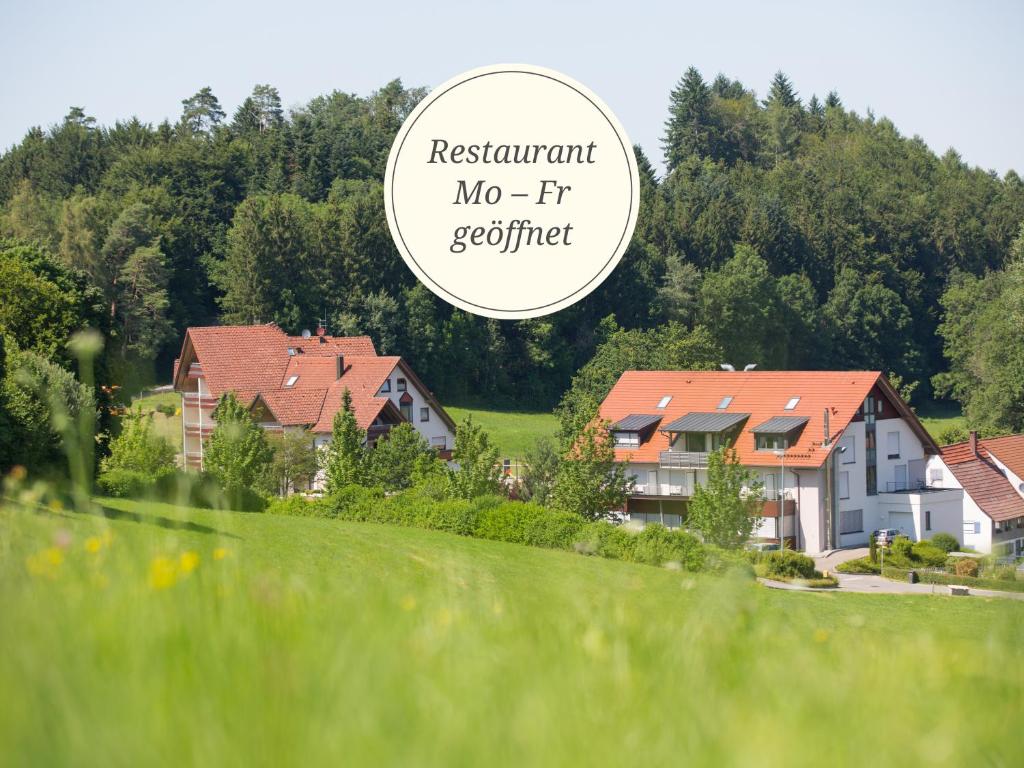 a group of houses in a field with the words restaurant no ffr certified at Hotel Restaurant JÄGERHAUS in Meckenbeuren