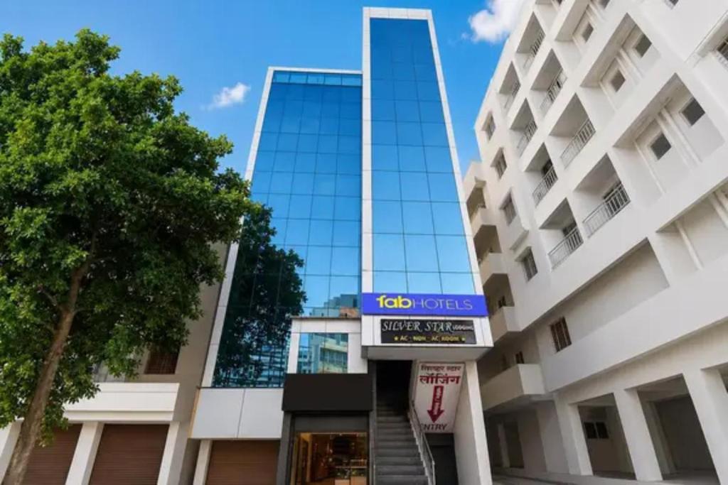 a building with a sign that reads ko tours at FabHotel Silver Star in Pune