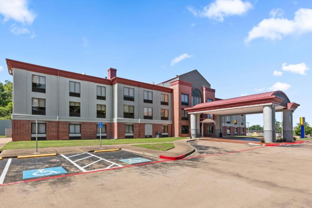 a gas station in front of a building at Comfort Inn & Suites Tyler North in Tyler