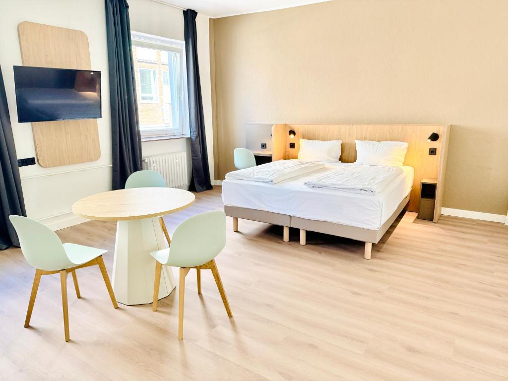 En eller flere senge i et værelse på Hotel am Kieler Schloss by Première Classe