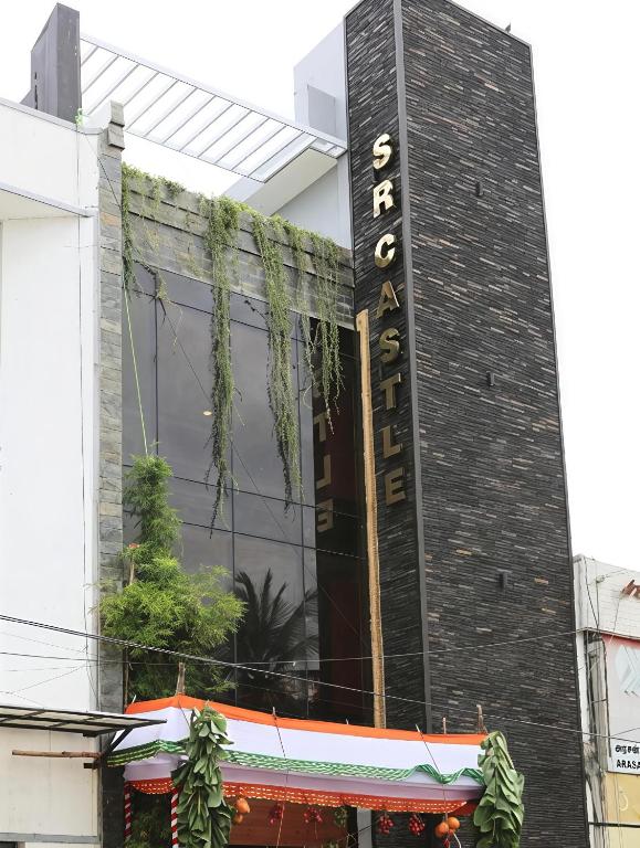 a building with a sign on the side of it at SR Castle Gopalapuram in Chennai