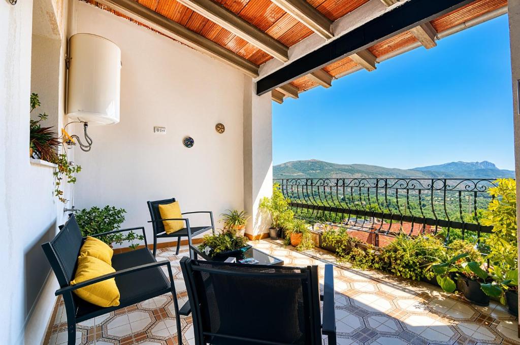 a patio with a view of the vineyards from a house at The Triplets in Agres