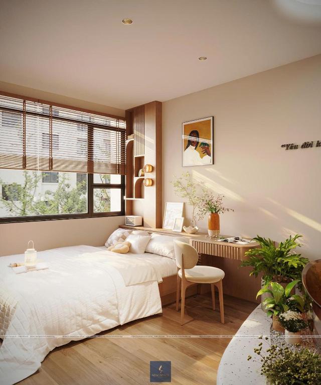 a bedroom with a large bed and a desk at Urban Nest in Hanoi