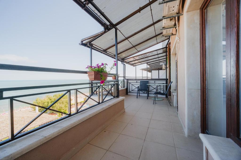 a balcony with a view of the ocean at Seafront Apartment with Panoramic Terrace in Golden Sands