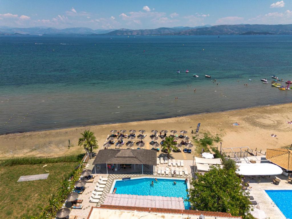 an aerial view of a beach with a swimming pool at The Kavos Sandy Inn in Kavos