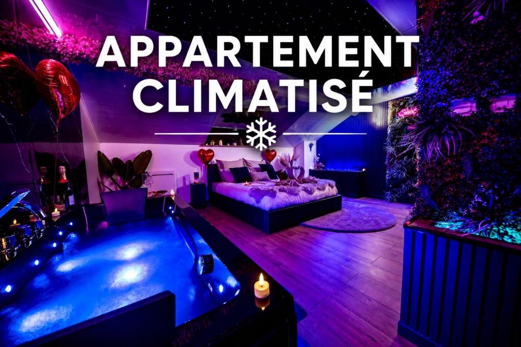 a living room with a couch and a swimming pool at Love Room Serenity Suite in Montbéliard