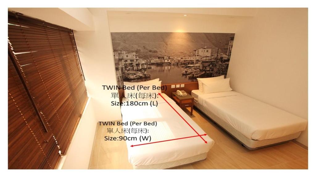 a room with a bed and a picture of a city at The Salvation Army - Booth Lodge in Hong Kong