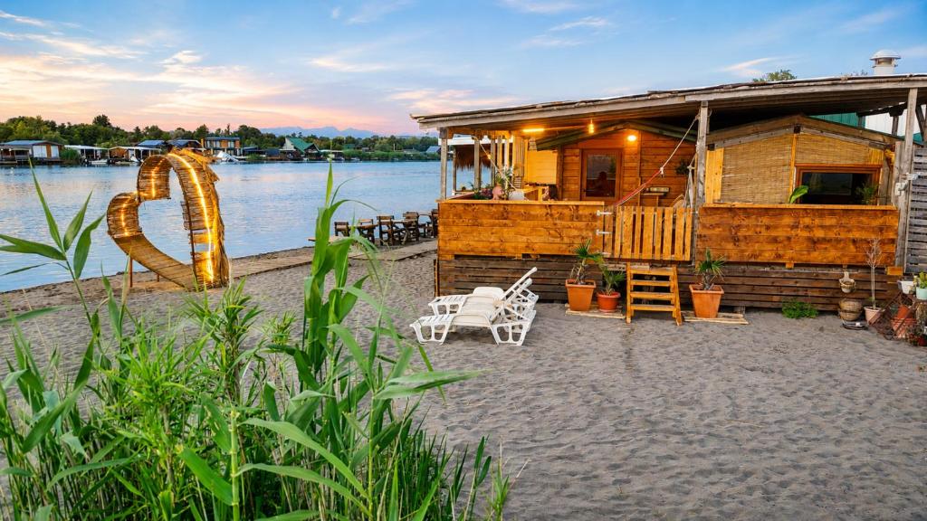 a house on the shore of a body of water at Ćićkova Čarda in Ulcinj