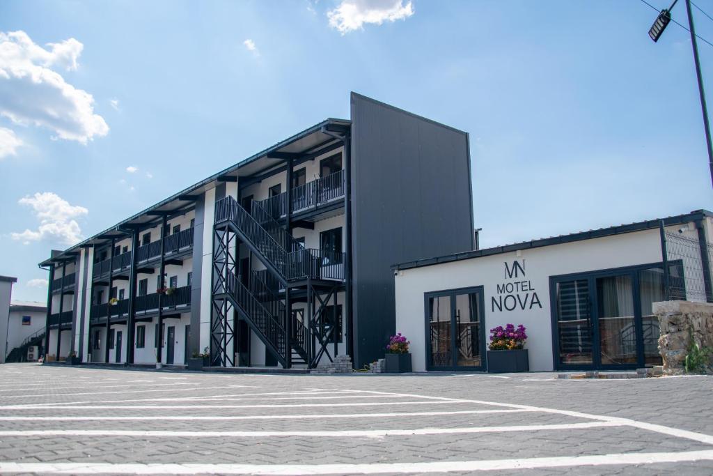 an empty parking lot in front of a building at Motel Nova in Strumica