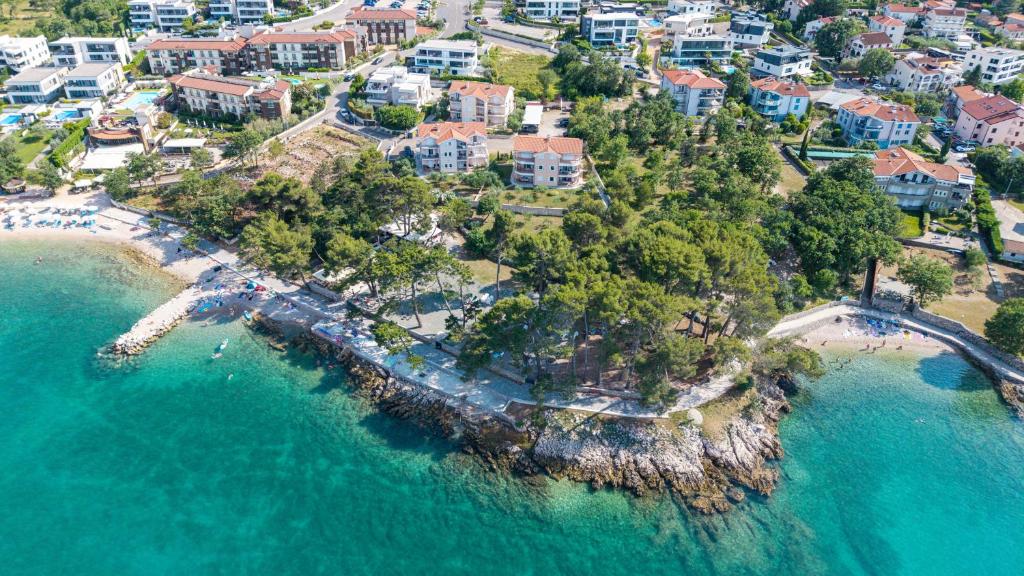 an aerial view of a resort near the ocean at Mare & Mons Seafront Apartments in Malinska