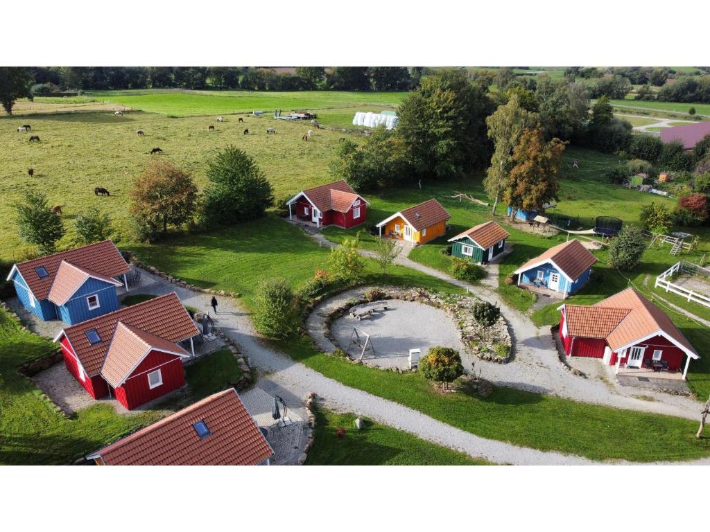 an aerial view of a village with red and blue houses at Mitteltalhof in Kaufungen