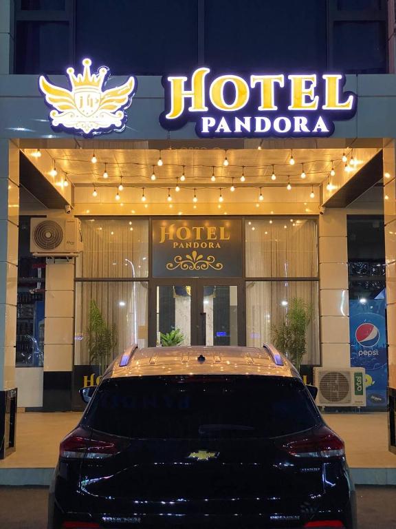 a car parked in front of a hotel pancho at Pandora Hotel in Samarkand