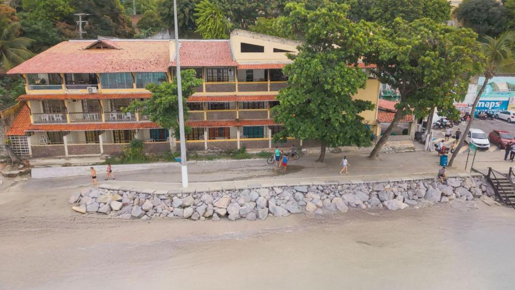 an overhead view of a building next to the water at Beachhotel Morro do Careca in Natal