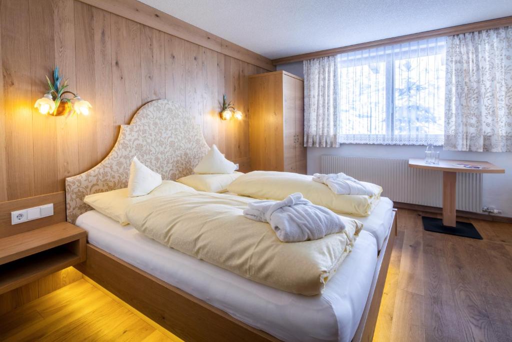 Postel nebo postele na pokoji v ubytování Hotel Anemone