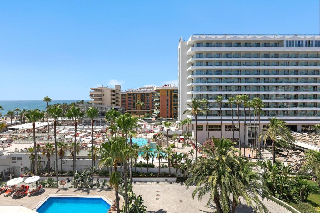 an aerial view of a resort with a pool and a beach at SOL by Meliá Torremolinos Don Pablo in Torremolinos