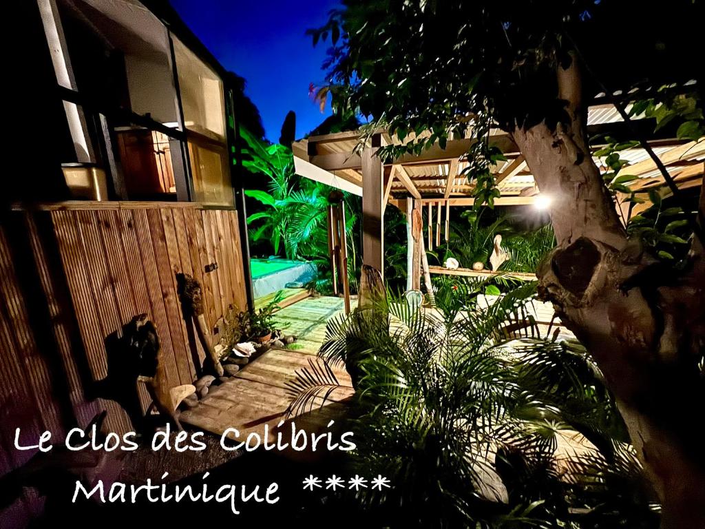 a picture of a house with the words leos does collours mariculture at LODGE COLIBRIS Piscine Privée vue panoramique mer et montagne pelée , 500 m plage dans un parc , Calme assuré Idéal pour découvrir le nord Caraïbes in Le Carbet