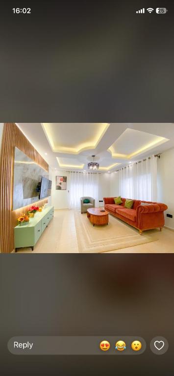 a living room with a couch and a table at The Kings quarters in Kampala