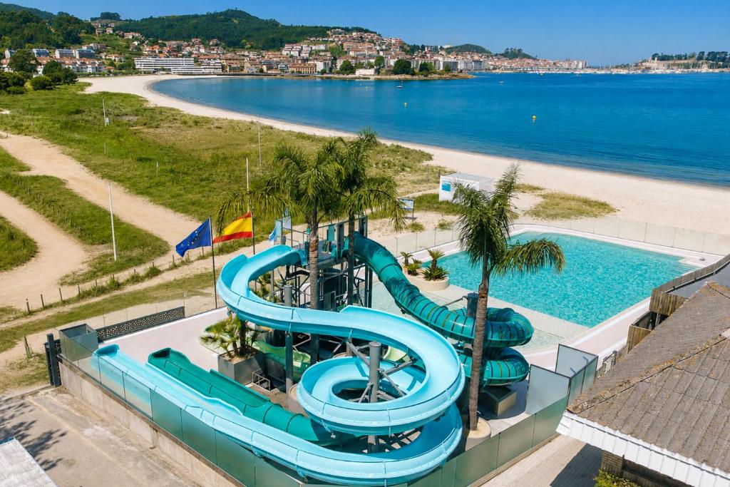 an image of a water slide at a beach at Kampaoh Bayona Playa in Baiona