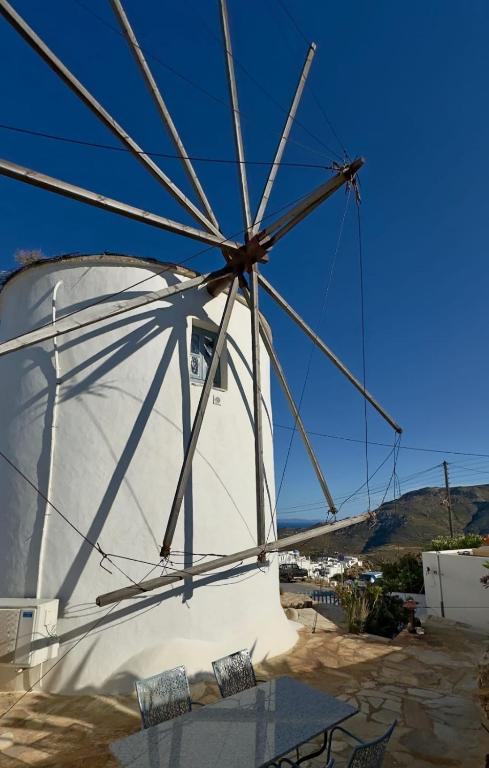 a windmill on the side of a boat at The Windmill Serifos in Serifos Chora