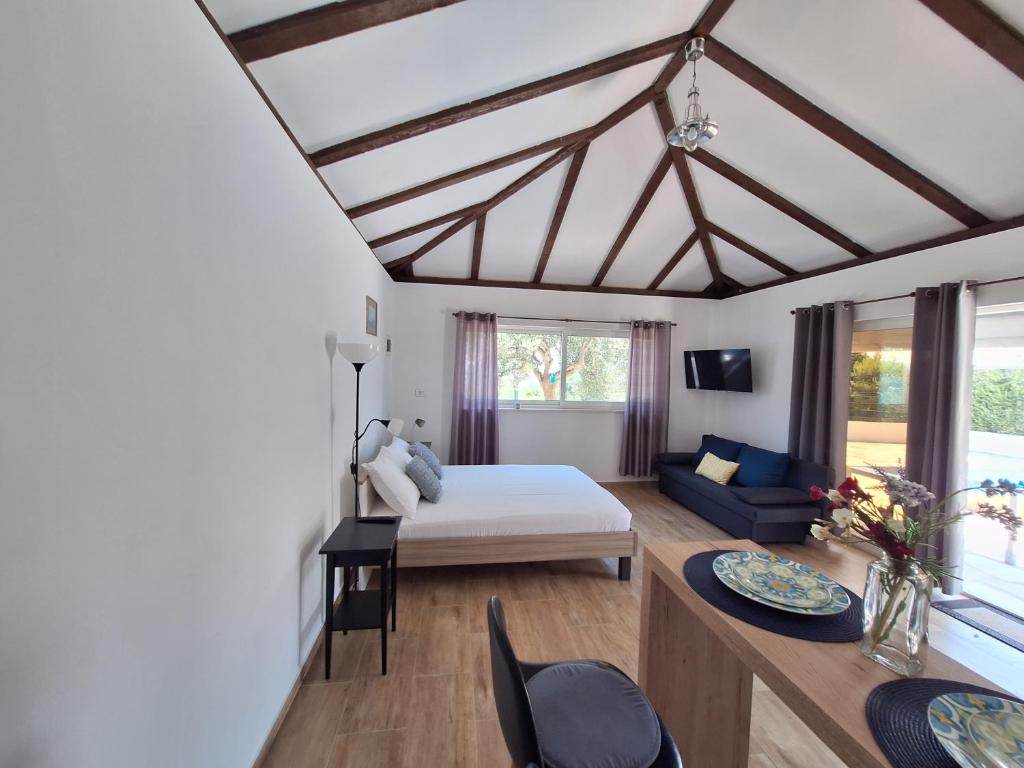 a bedroom with a bed and a living room at Relax in Orebić
