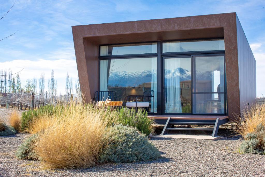 a house with a view of the mountains at Andeluna Winery Lodge in Tupungato